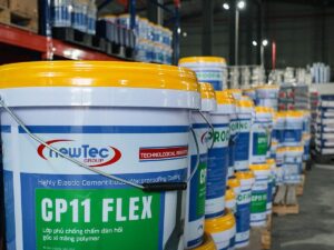 Buckets of waterproofing paint arranged in a warehouse setting.