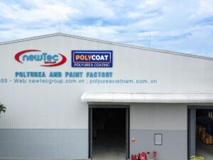 Industrial building with signage for a polyurea and paint factory.